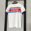 Maillot-PSG-2026-2027-entrainement-Blanc-A-A.jpg Maillot de foot PSG 2026/2027 - Entraînement Blanc